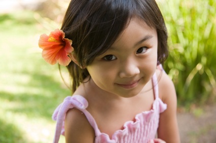 Little girl with flower in her hair.